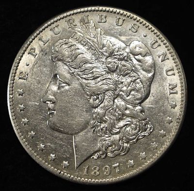 1897-O MORGAN DOLLAR CH AU. WEEKLY COIN & CURRENCY AUCTIONS ESTIMATE $300 - $400.
