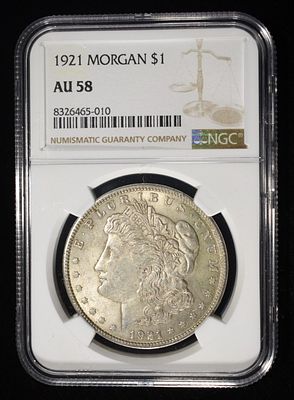 1921 MORGAN DOLLAR NGC AU58. TOP RATED AUCTION HOUSE ESTIMATE $80 - $120.