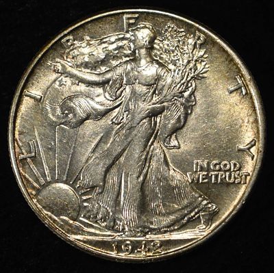 1942 WALKING LIBERTY HALF AU/BU. LEADERS IN ON-LINE AUCTIONS ESTIMATE $50 - $75.