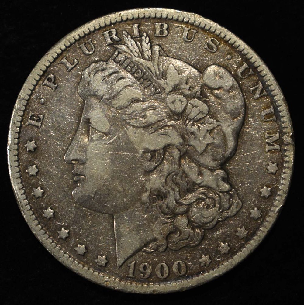 1900-O/CC MORGAN DOLLAR VF. WEEKLY COIN & CURRENCY AUCTIONS ESTIMATE $170 - $200.