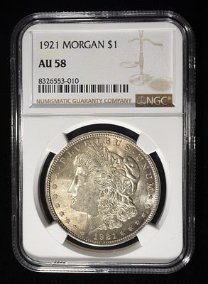1921 MORGAN DOLLAR NGC AU58. TOP RATED AUCTION HOUSE ESTIMATE $80 - $120.