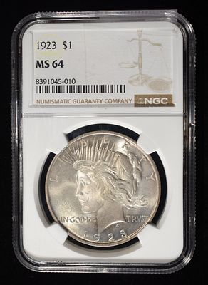 1923 PEACE DOLLAR NGC MS64. CHECK OUT OUR UPCOMING AUCTIONS ESTIMATE $100 - $150.