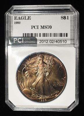 1992 AMERICAN SILVER EAGLE PCI PERFECT GEM BU. CHECK OUT OUR UPCOMING AUCTIONS ESTIMATE $110 - $160.