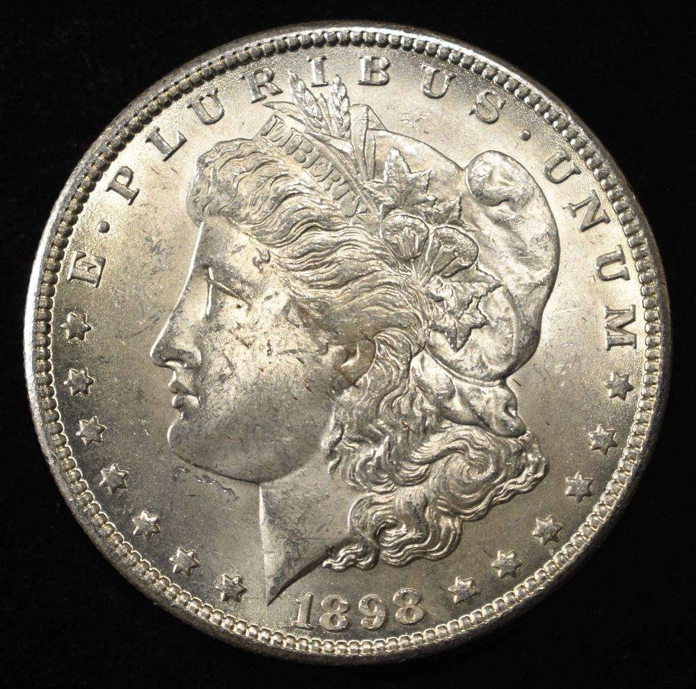 1898-O MORGAN DOLLAR CH BU. LEADERS IN ON-LINE AUCTIONS ESTIMATE $130 - $150.