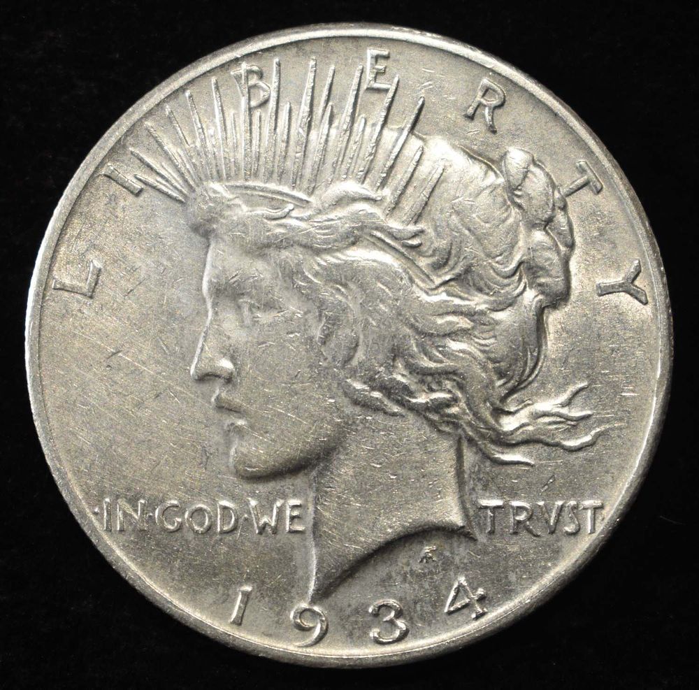 1934-S PEACE DOLLAR VF. CHECK OUT OUR UPCOMING AUCTIONS ESTIMATE $100 - $130.