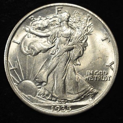 1935 WALKING LIBERTY HALF DOLLAR GEM BU. CHECK OUT OUR UPCOMING AUCTIONS ESTIMATE $300 - $400.