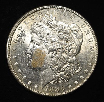 1886 MORGAN DOLLAR AU/BU. WEEKLY COIN & CURRENCY AUCTIONS ESTIMATE $100 - $130.