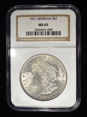 1921 MORGAN DOLLAR NGC MS63. TOP RATED AUCTION HOUSE ESTIMATE $80 - $120.