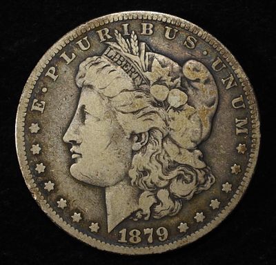 1879-S MORGAN DOLLAR. CHECK OUT OUR UPCOMING AUCTIONS ESTIMATE $90 - $130.