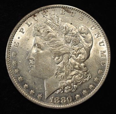 1880-O MORGAN DOLLAR CH AU. CHECK OUT OUR UPCOMING AUCTIONS ESTIMATE $100 - $130.
