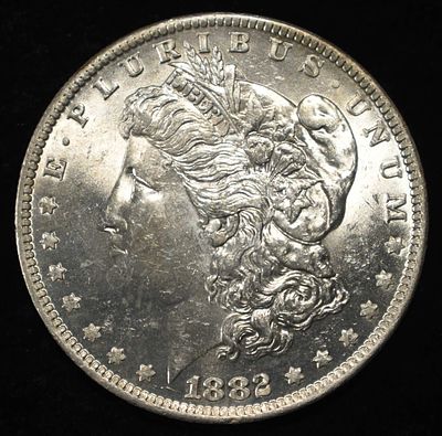 1882-O/S MORGAN DOLLAR CH BU. CHECK OUT OUR UPCOMING AUCTIONS ESTIMATE $450 - $550.