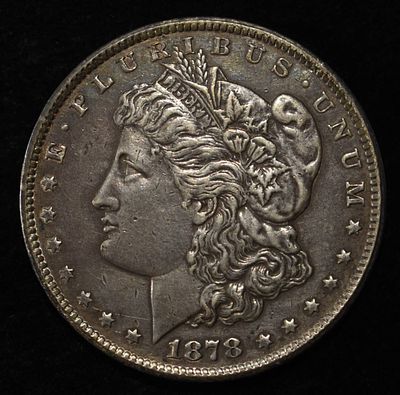 1878-CC MORGAN DOLLAR XF/AU. CHECK OUT OUR UPCOMING AUCTIONS ESTIMATE $300 - $350.