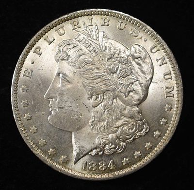 1884-O MORGAN DOLLAR CH BU. CHECK OUT OUR UPCOMING AUCTIONS ESTIMATE $120 - $170.