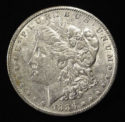 1886-O MORGAN DOLLAR AU. WEEKLY COIN & CURRENCY AUCTIONS ESTIMATE $170 - $200.