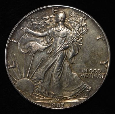 1987 AMERICAN SILVER EAGLE. TOP RATED AUCTION HOUSE ESTIMATE $100 - $150.