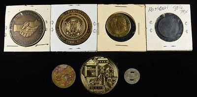 (7) MISC. TOKENS. WEEKLY COIN & CURRENCY AUCTIONS ESTIMATE $60 - $80.