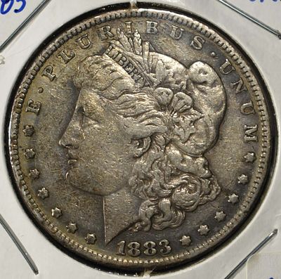 1883-S MORGAN DOLLAR. TOP RATED AUCTION HOUSE ESTIMATE $90 - $130.