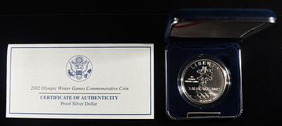 2002 OLYMPIC WINTER GAMES SILVER DOLLAR. COMMEMORATIVE SILVER COINS ESTIMATE $90 - $130.