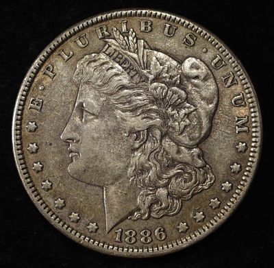 1886 MORGAN DOLLAR. WEEKLY COIN & CURRENCY AUCTIONS ESTIMATE $90 - $130.