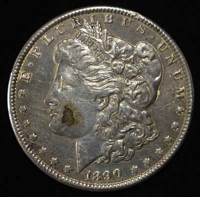 1890 MORGAN DOLLAR. CHECK OUT OUR UPCOMING AUCTIONS ESTIMATE $90 - $130.