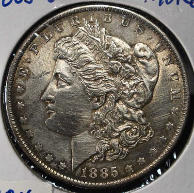 1885-O MORGAN DOLLAR. LEADERS IN ON-LINE AUCTIONS ESTIMATE $120 - $170.