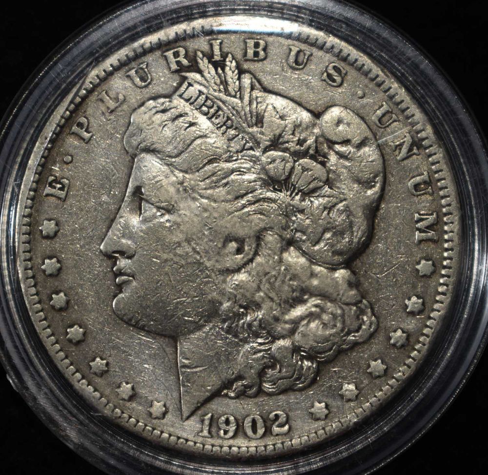 1902 MORGAN DOLLAR. CHECK OUT OUR UPCOMING AUCTIONS ESTIMATE $90 - $130.