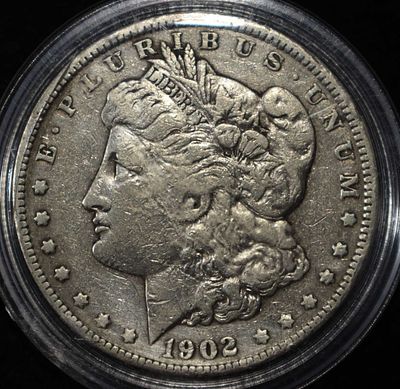 1902 MORGAN DOLLAR. CHECK OUT OUR UPCOMING AUCTIONS ESTIMATE $90 - $130.