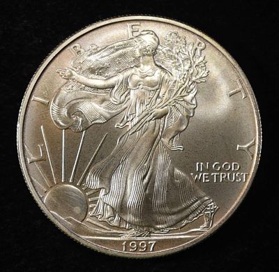 1997 AMERICAN SILVER EAGLE. CHECK OUT OUR UPCOMING AUCTIONS ESTIMATE $100 - $150.