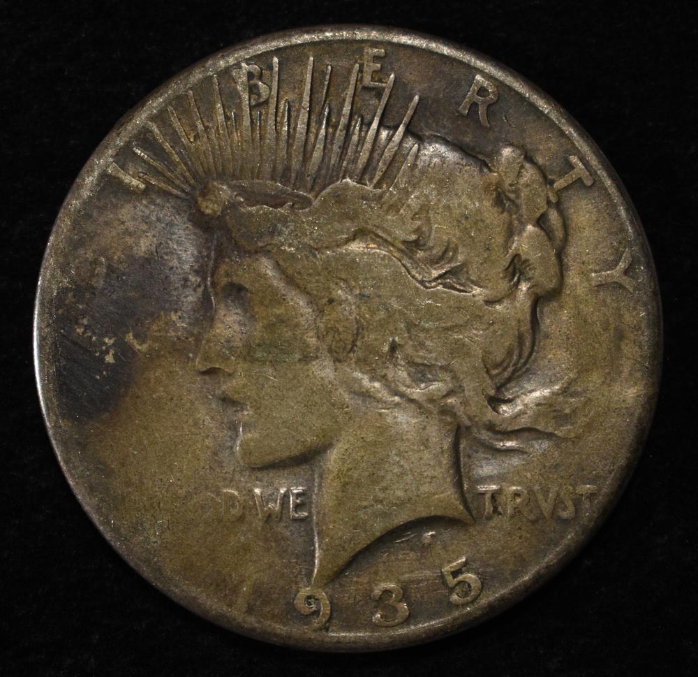 1935-S PEACE DOLLAR. BID WITH SILVER CITY AUCTIONS ESTIMATE $90 - $130.