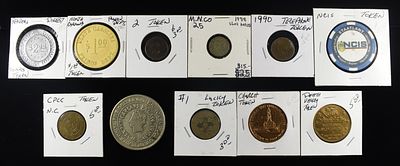 TOKEN COLLECTORS LOT. INCLUDING (1) NCIS TOKEN, (1) 1938 SLOT TOKEN, (1) GAMING TOKEN & (8) MICS 