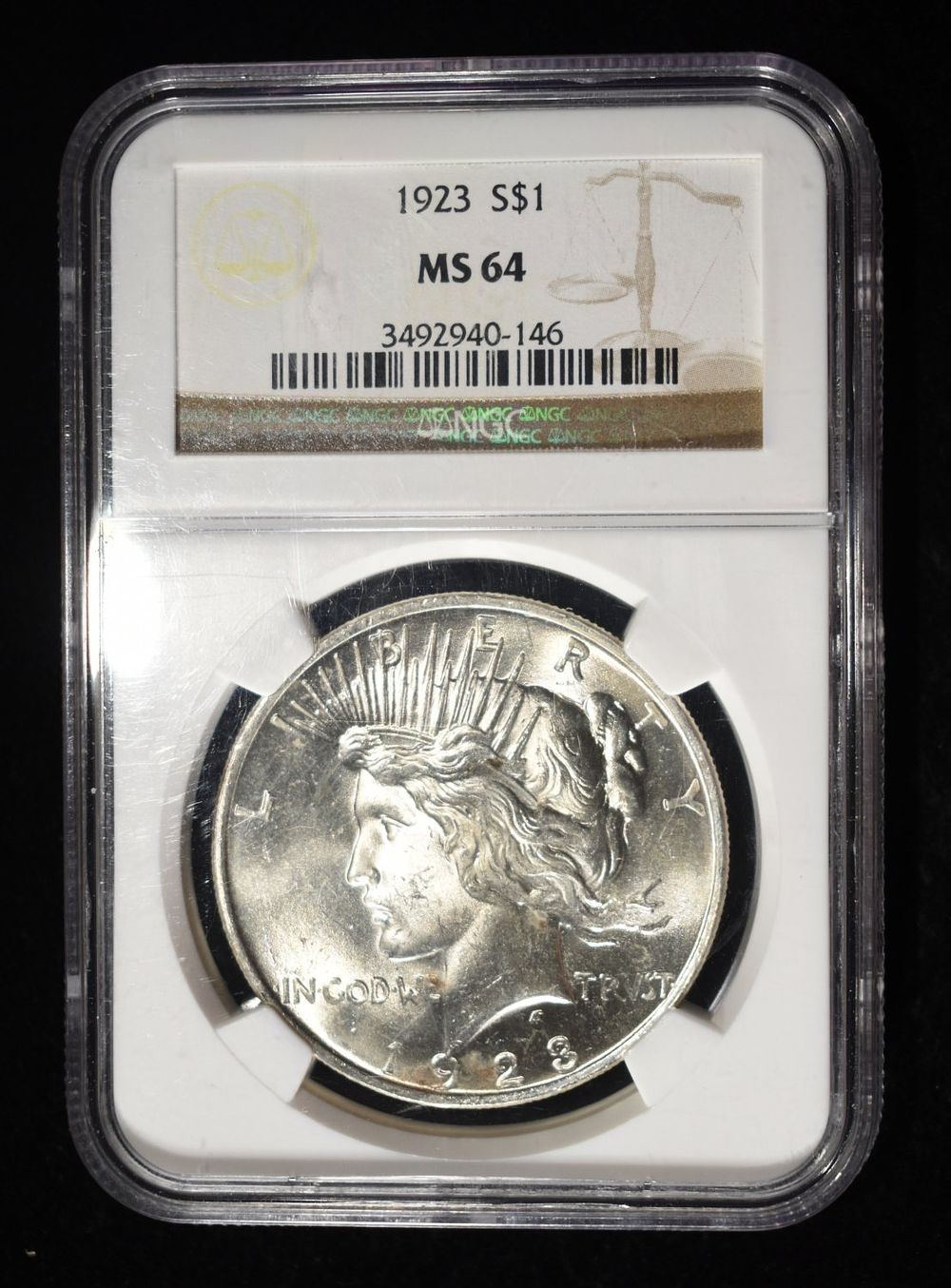 1923 PEACE DOLLAR NGC MS64. TOP RATED AUCTION HOUSE ESTIMATE $90 - $130.