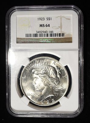 1923 PEACE DOLLAR NGC MS64. TOP RATED AUCTION HOUSE ESTIMATE $90 - $130.