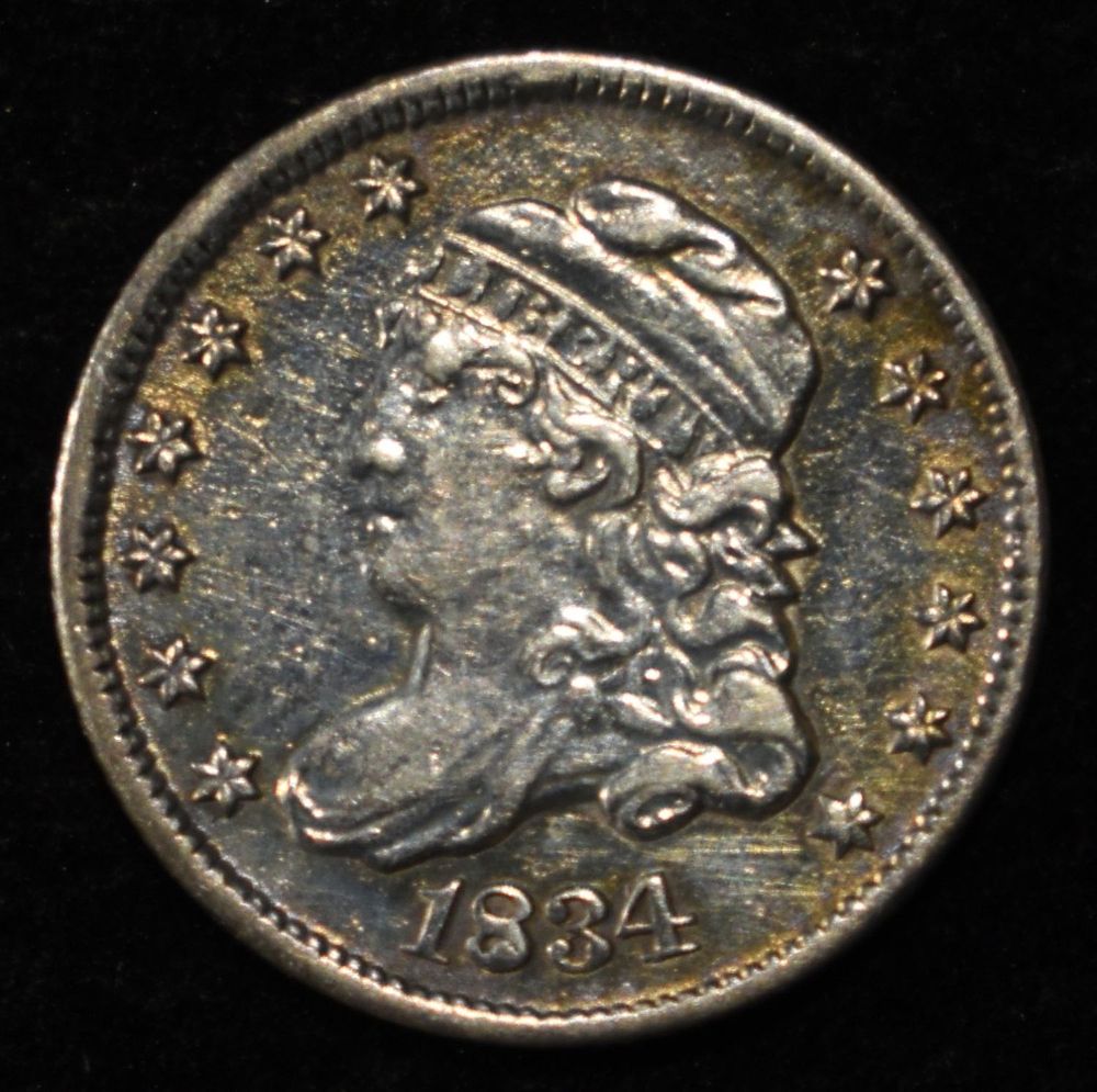 1834 BUST HALF DIME AU. BID WITH SILVER CITY AUCTIONS ESTIMATE $250 - $300.