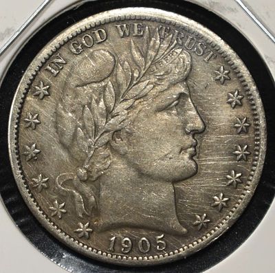 1905 BARBER HALF DOLLAR. CHECK OUT OUR UPCOMING AUCTIONS ESTIMATE $220 - $270.