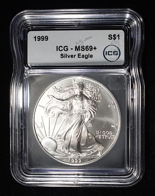 1999 AMERICAN SILVER EAGLE ICG MS69+. BID WITH SILVER CITY AUCTIONS ESTIMATE $150 - $200.