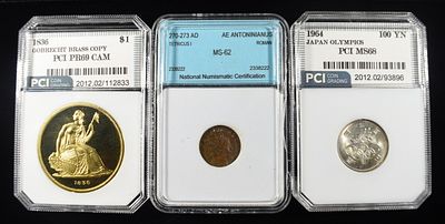 (3) MIXED GRADED COINS. 1836 GOBRECHT BRASS COPY PCI SUPERB GEM PROOF CAM, 1964 JAPAN OLYMPICS 