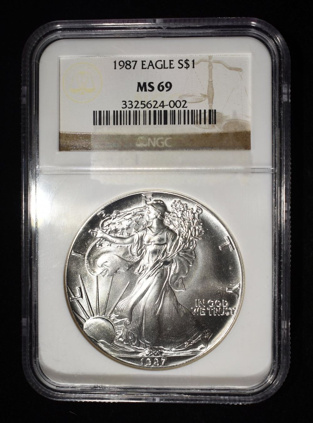 1987 AMERICAN SILVER EAGLE NGC MS69. WEEKLY COIN & CURRENCY AUCTIONS ESTIMATE $110 - $160.