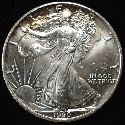 1990 AMERICAN SILVER EAGLE. TOP RATED AUCTION HOUSE ESTIMATE $110 - $160.