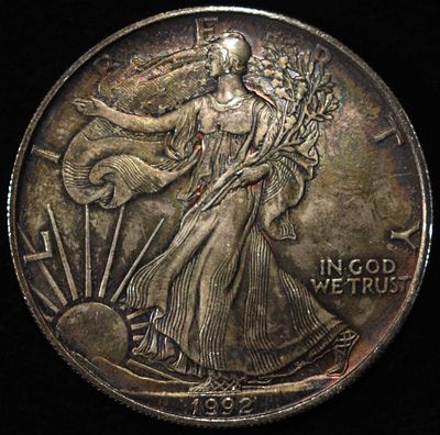 1992 AMERICAN SILVER EAGLE. WEEKLY COIN & CURRENCY AUCTIONS ESTIMATE $110 - $160.