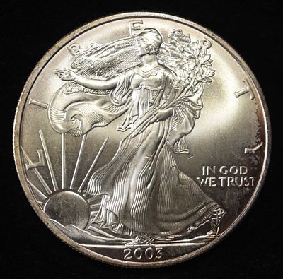 2003 AMERICAN SILVER EAGLE. CHECK OUT OUR UPCOMING AUCTIONS ESTIMATE $110 - $160.