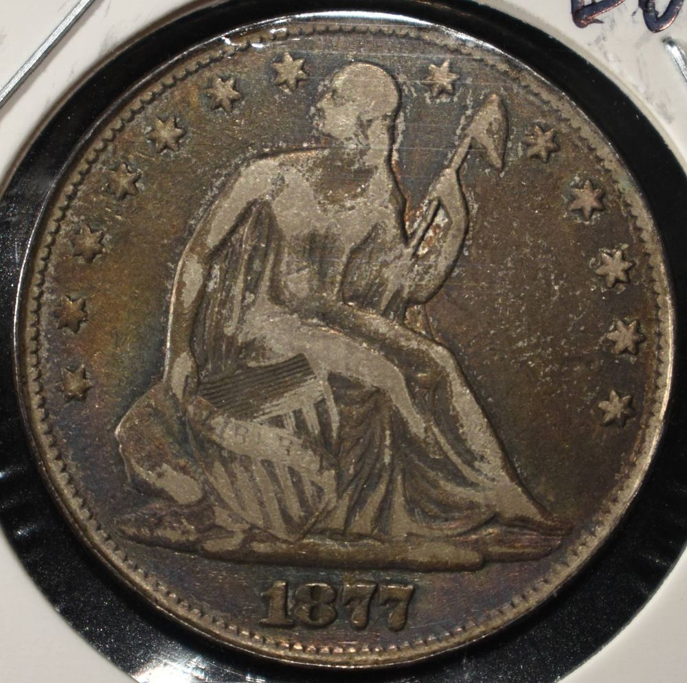 1877 SEATED LIBERTY HALF DOLLAR. TOP RATED AUCTION HOUSE ESTIMATE $110 - $160.
