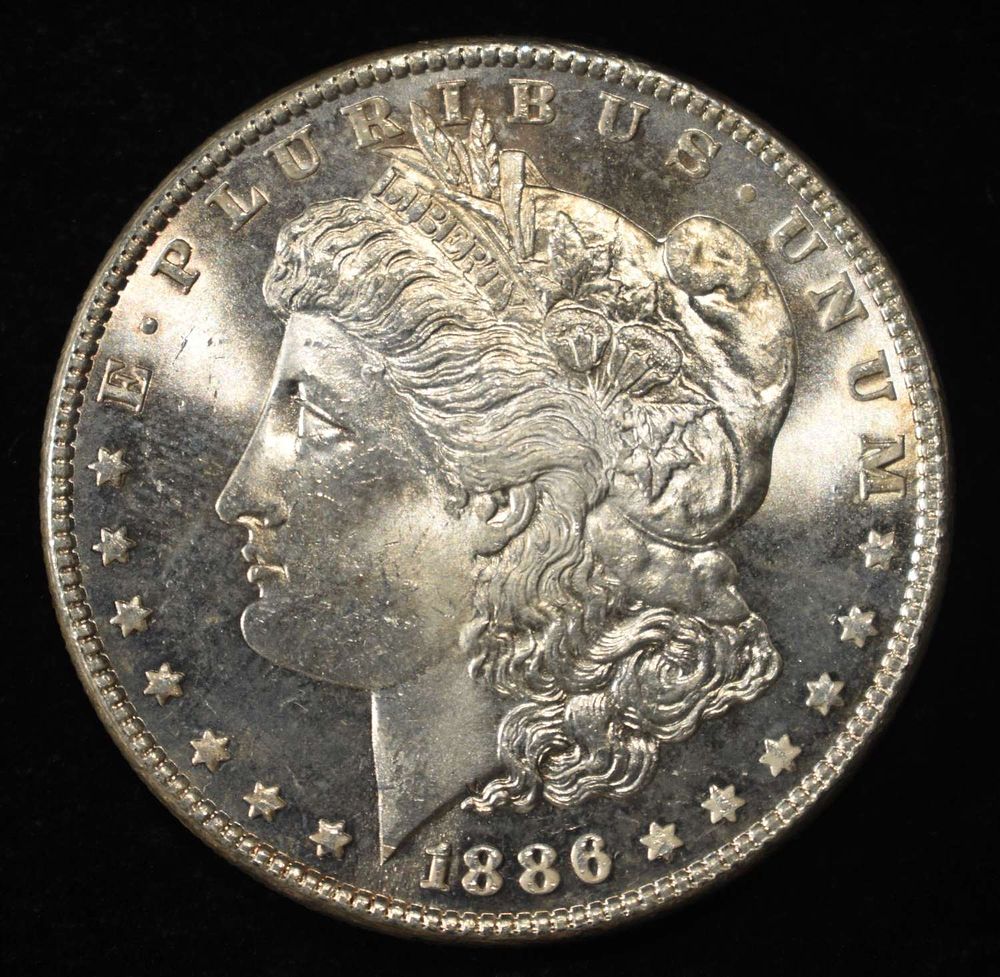 1886 MORGAN DOLLAR GEM BU PROOFLIKE. WEEKLY COIN & CURRENCY AUCTIONS ESTIMATE $390 - $440.