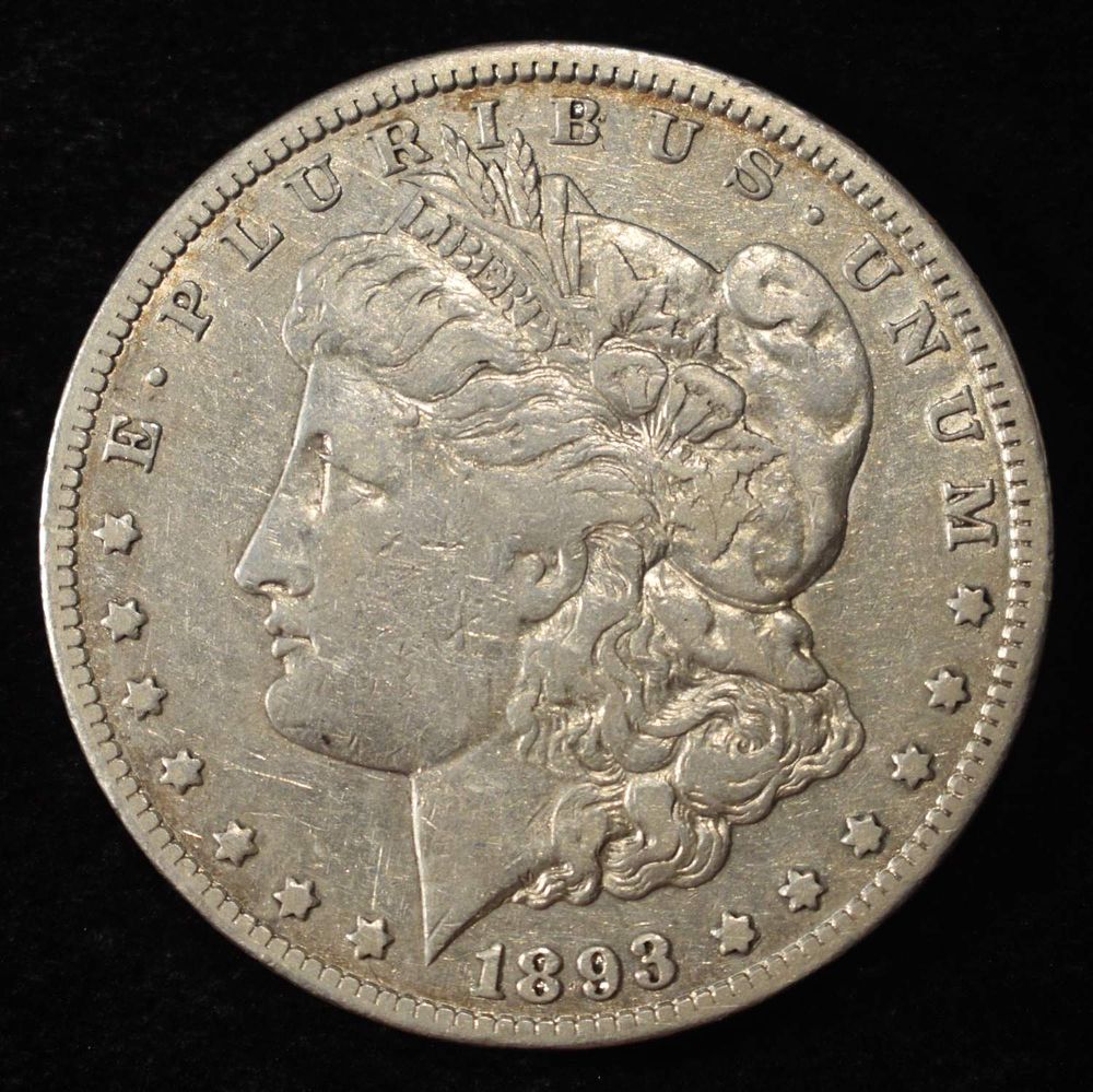 1893-CC MORGAN DOLLAR VF/XF. TOP RATED AUCTION HOUSE ESTIMATE $1700 - $2200.