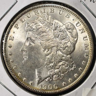 1900 MORGAN DOLLAR. CHECK OUT OUR UPCOMING AUCTIONS ESTIMATE $90 - $130.