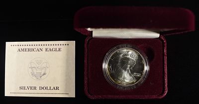1990 AMERICAN SILVER EAGLE. LEADERS IN ON-LINE AUCTIONS ESTIMATE $110 - $160.