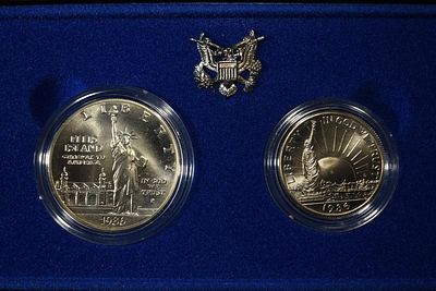 1986-P $1 & 1986-D 50c COMMEM STATUE OF LIBERTY. TOP RATED AUCTION HOUSE ESTIMATE $100 - $150.