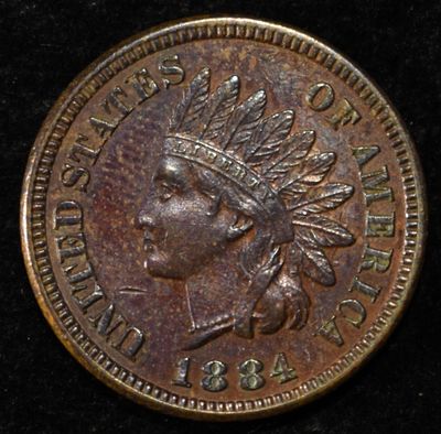 1884 INDIAN CENT AU/BU. CHECK OUT OUR UPCOMING AUCTIONS ESTIMATE $80 - $100.