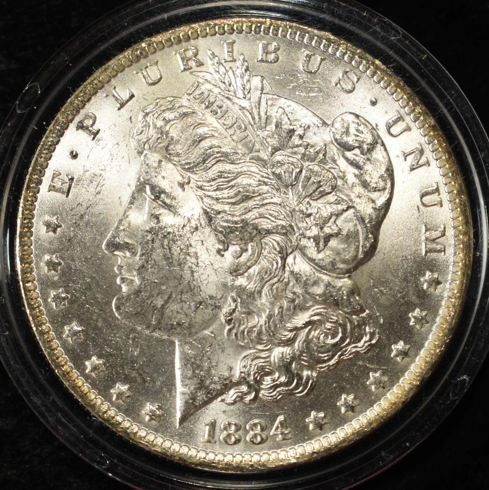 1884-O MORGAN DOLLAR CH BU. CHECK OUT OUR UPCOMING AUCTIONS ESTIMATE $100 - $130.
