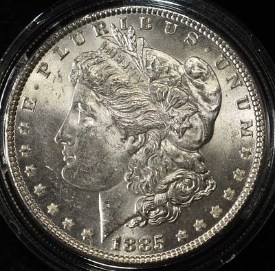 1885 MORGAN DOLLAR CH BU. BID WITH SILVER CITY AUCTIONS ESTIMATE $100 - $130.
