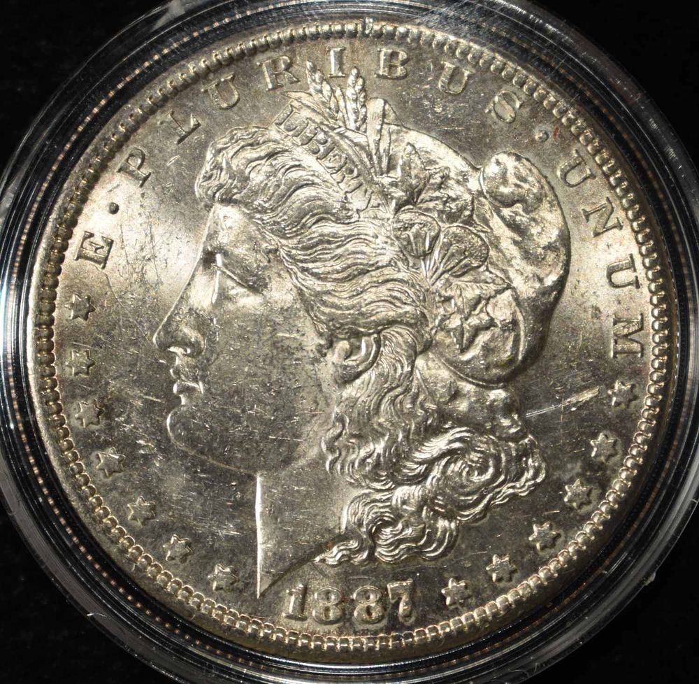 1887-S MORGAN DOLLAR BU. BID WITH SILVER CITY AUCTIONS ESTIMATE $250 - $300.